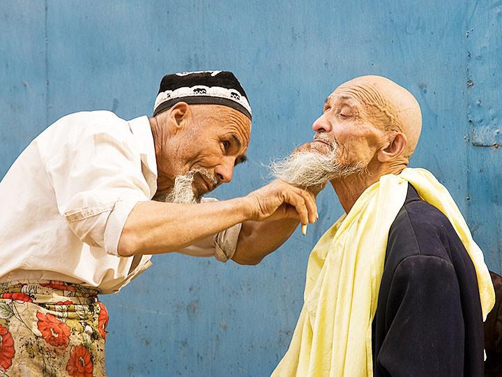 Barber in Kashgar, Xinjiang Uyghur Autonomous Region, near the border with Kyrgyzstan