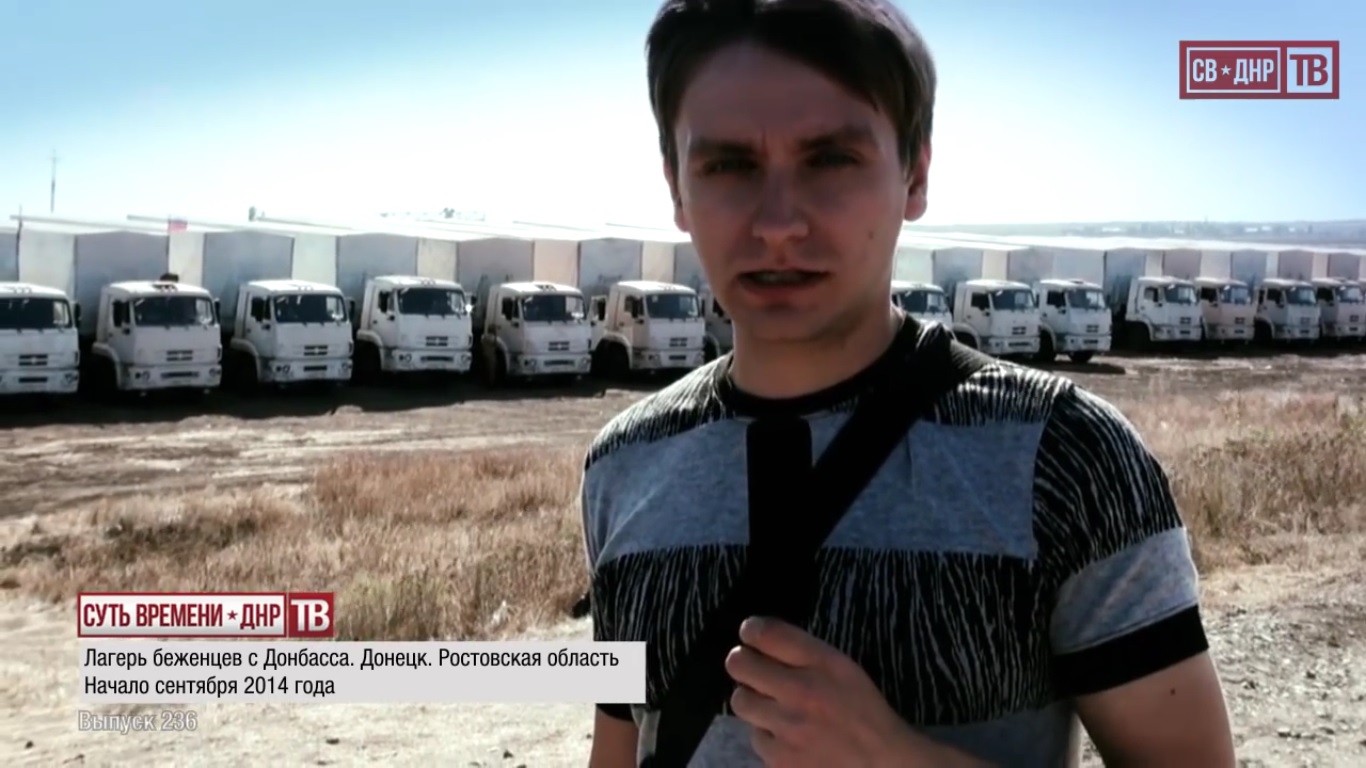 Igor Yudin, call sign Bolgarin, reporting from a refugee camp for residents of Ukraine in Rostov region, Russia. September 2014.  Still from EoT-DPR TV Issue 236
