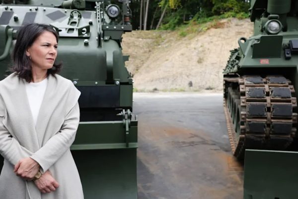 Image by Christian Harisius/dpa German Foreign Minister Annalena Berbock in front of refurbished tanks and new vehicles during a visit to a defense company in Flensburg, Germany