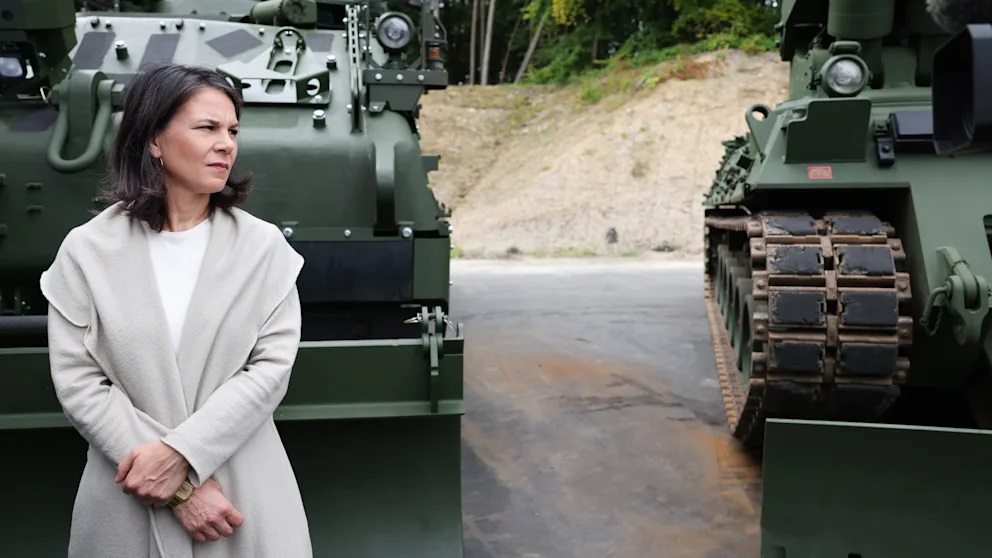 Image by Christian Harisius/dpa German Foreign Minister Annalena Berbock in front of refurbished tanks and new vehicles during a visit to a defense company in Flensburg, Germany